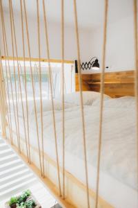 a bed in a room with a view of the ocean at Bambi Boutique Rooms - Loftové izby 300 m od centra Banskej Bystrice, Self check-in in Banská Bystrica