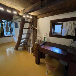 a room with a desk and a ladder in a room at Alleyway 모퉁이 in Jeonju
