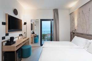 Postel nebo postele na pokoji v ubytování Hotel Royal Village