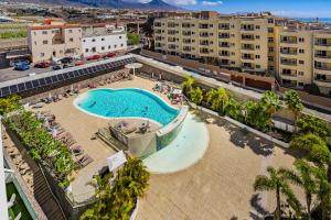 an overhead view of a swimming pool in a city at Poolside Escape - airco & heated pool in Adeje