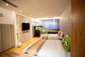 TV a/nebo společenská místnost v ubytování Garden Spring Hotel