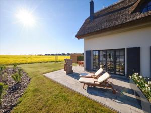 Zahrada ubytování Reetland am Meer - LuxusPlus Reetdachvilla mit 4 Schlafzimmern und Kamin G11