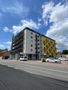 a large building on the side of a street at City Flat - Garage parking - TRITA SK in Poprad