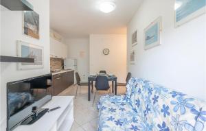 a living room with a couch and a table at La Piazzetta in Rosolina Mare