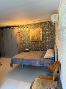 a room with two beds and a table in it at Art Lux Studio 1 in Burgas City +4 photos
