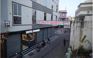 a group of motorcycles parked outside of a building at Hotel Kaanjee in Sīkar