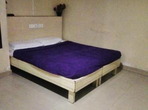 Postel nebo postele na pokoji v ubytování Nanda Lodge