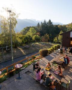 a group of people sitting on a park bench at Auberge de Jeunesse HI Annecy in Annecy +9 photos