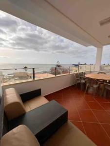 a living room with a view of the ocean at Rays View Moulay Bousselham in Moulay Bousselham