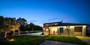 a house with a yard with a swimming pool at Villa Desire for 10 people in Central Istria with private 53 m2 pool and pet friendly in Juršići +48 photos