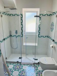 a bathroom with a shower and a toilet at B&B L'Agapanto in Capri