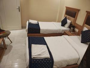 Postel nebo postele na pokoji v ubytování AB Hotel - Amar International by Sarthak - Local ID not accepted