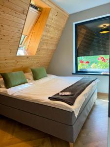 Postel nebo postele na pokoji v ubytování AHA Cabin + 14 fotografií