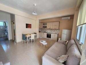 a living room with a couch and a table at Lindita Vila Vlora in Vlorë
