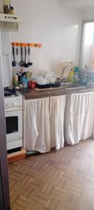 a kitchen with a table with a white table cloth on it at Cryptocalp in Calpe +18 photos