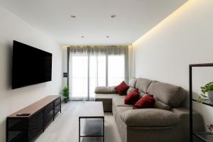 Μια τηλεόραση ή/και κέντρο ψυχαγωγίας στο Apartamento Orquideas