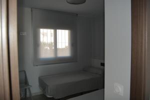 Posteľ alebo postele v izbe v ubytovaní ROMERO APARTMENTS-ARENALES DEL SOL