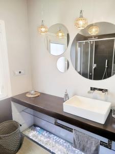 a bathroom with a sink and a mirror at Areal de Esteiro in Esteiro-Muros +17 photos