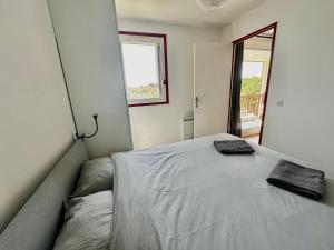 Posteľ alebo postele v izbe v ubytovaní Capucine, duplex à 5 min plage