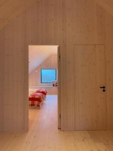 an open door into a bedroom with two beds at Gåvetorps Gård in Alvesta