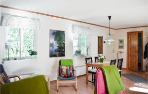a kitchen and dining room with a table and chairs at Cozy Home In Ålem With Kitchen in Ålem