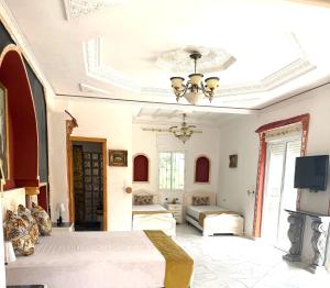 Ένα ή περισσότερα κρεβάτια σε δωμάτιο στο Malabata Guest House