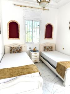 Ένα ή περισσότερα κρεβάτια σε δωμάτιο στο Malabata Guest House