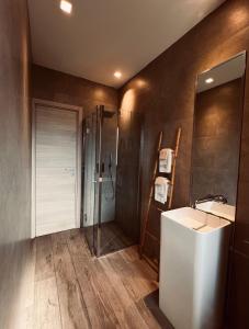 a bathroom with a sink and a shower at La Tana Del Ludo in Baveno +69 photos