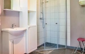 a bathroom with a sink and a shower at Lasses Stuga in Visby