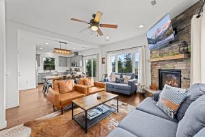 a living room with a couch and a fireplace at 838B Wapiti Dr in Fraser