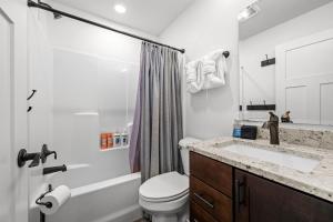a bathroom with a sink and a toilet and a shower at 838B Wapiti Dr in Fraser +49 photos