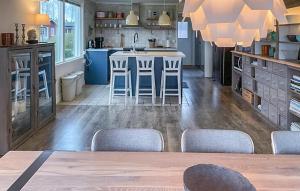 a kitchen with a table and chairs in a room at Cozy Home In Tofta With Wifi in Tofta