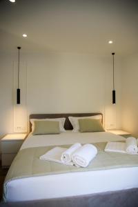 Ένα ή περισσότερα κρεβάτια σε δωμάτιο στο Apartments Dare & Piccolo