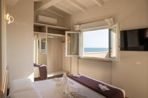 Ένα ή περισσότερα κρεβάτια σε δωμάτιο στο Junior Suite Hotel Biagi +39 φωτογραφίες