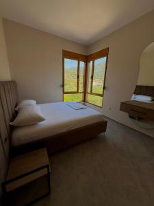 Postel nebo postele na pokoji v ubytování Kolagji Villas + 22 fotografií