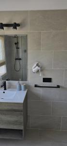 a bathroom with a sink and a tub and a mirror at Villa Can Kiko Ibiza in San Jose