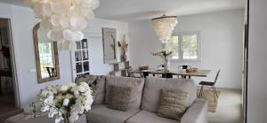 a living room with a couch and a dining room table at Villa Can Kiko Ibiza in San Jose