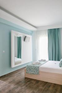 Posteľ alebo postele v izbe v ubytovaní Anastasia Rooms