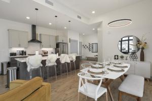 a kitchen and living room with a table and chairs at Timber Fox Building B Unit 2102 in Winter Park