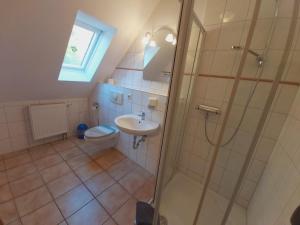 Et badeværelse på Katrins am Kölpinsee Appartement