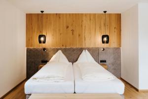 Postel nebo postele na pokoji v ubytování Hotel Thurnerhof