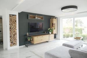 Μια τηλεόραση ή/και κέντρο ψυχαγωγίας στο Haus in der Natur für Familien in der Nähe des Bodensee
