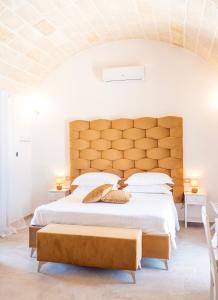 Giường trong phòng chung tại TENUTA DOROLIVO Agri Relais
