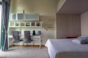 En eller flere senge i et værelse på Belvedere Guest House