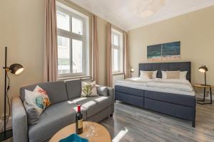 Un pat sau paturi într-o cameră la Villa Carmen Dünengras