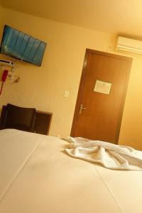 Postel nebo postele na pokoji v ubytování Hotel Flórida
