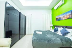 Pool Villa Near Jomtien Beach on Thep Prasit Road房間的床