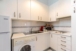 Kuchyň nebo kuchyňský kout v ubytování GY Apartamento en Casa Sevillana junto a las Setas