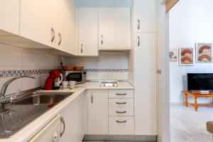 Kuchyň nebo kuchyňský kout v ubytování GY Apartamento en Casa Sevillana junto a las Setas