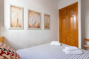 Postel nebo postele na pokoji v ubytování GY Apartamento en Casa Sevillana junto a las Setas